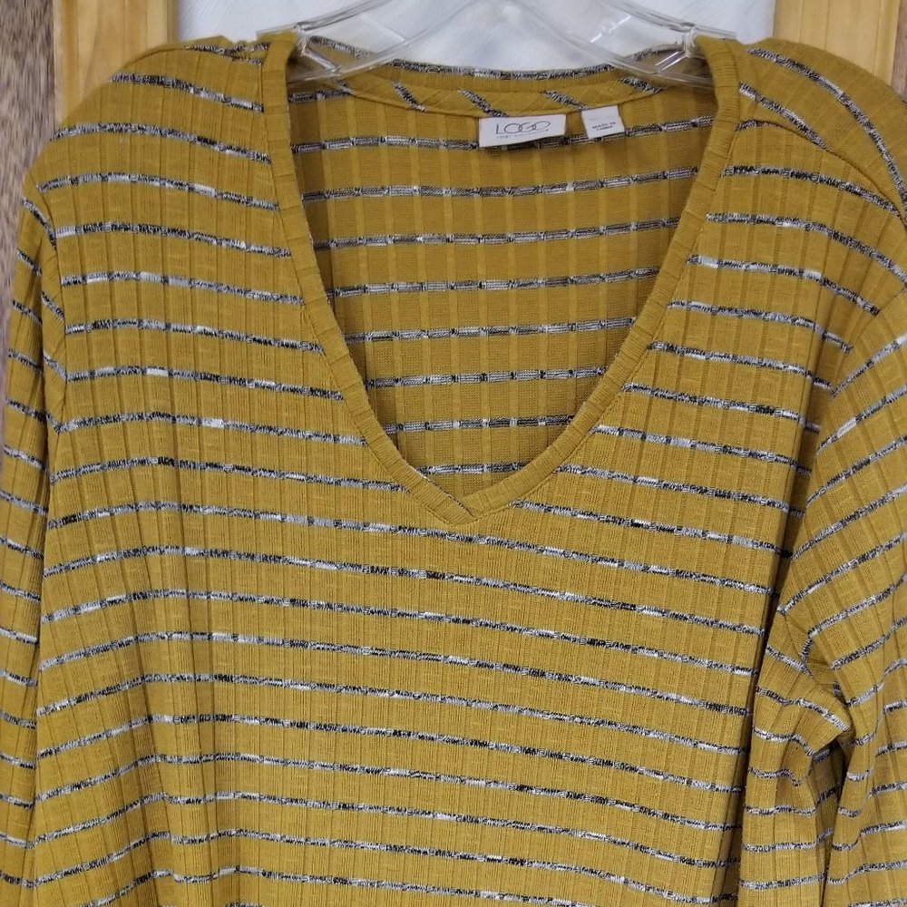Logo by Lore Goldstein Tunic